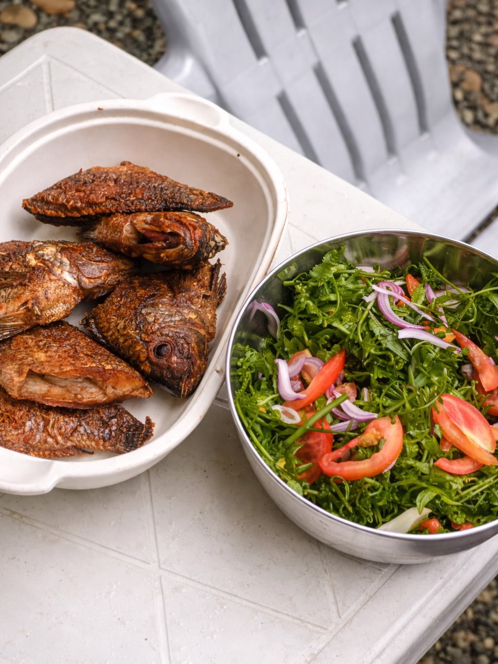 Fried fish and fresh kale salad — farm-fresh meals at Sapa