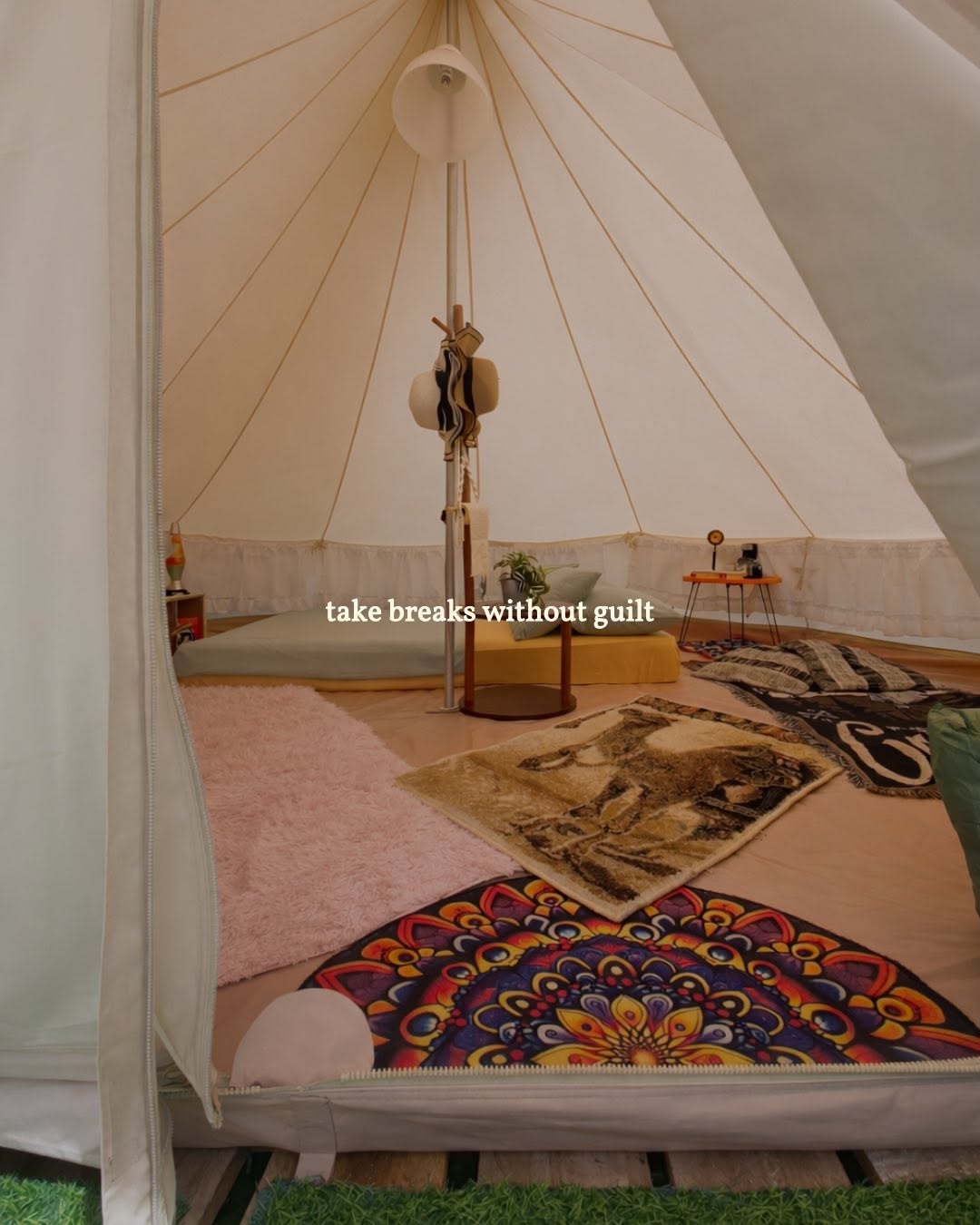 Belle tent interior with boho furnishings and canvas ceiling